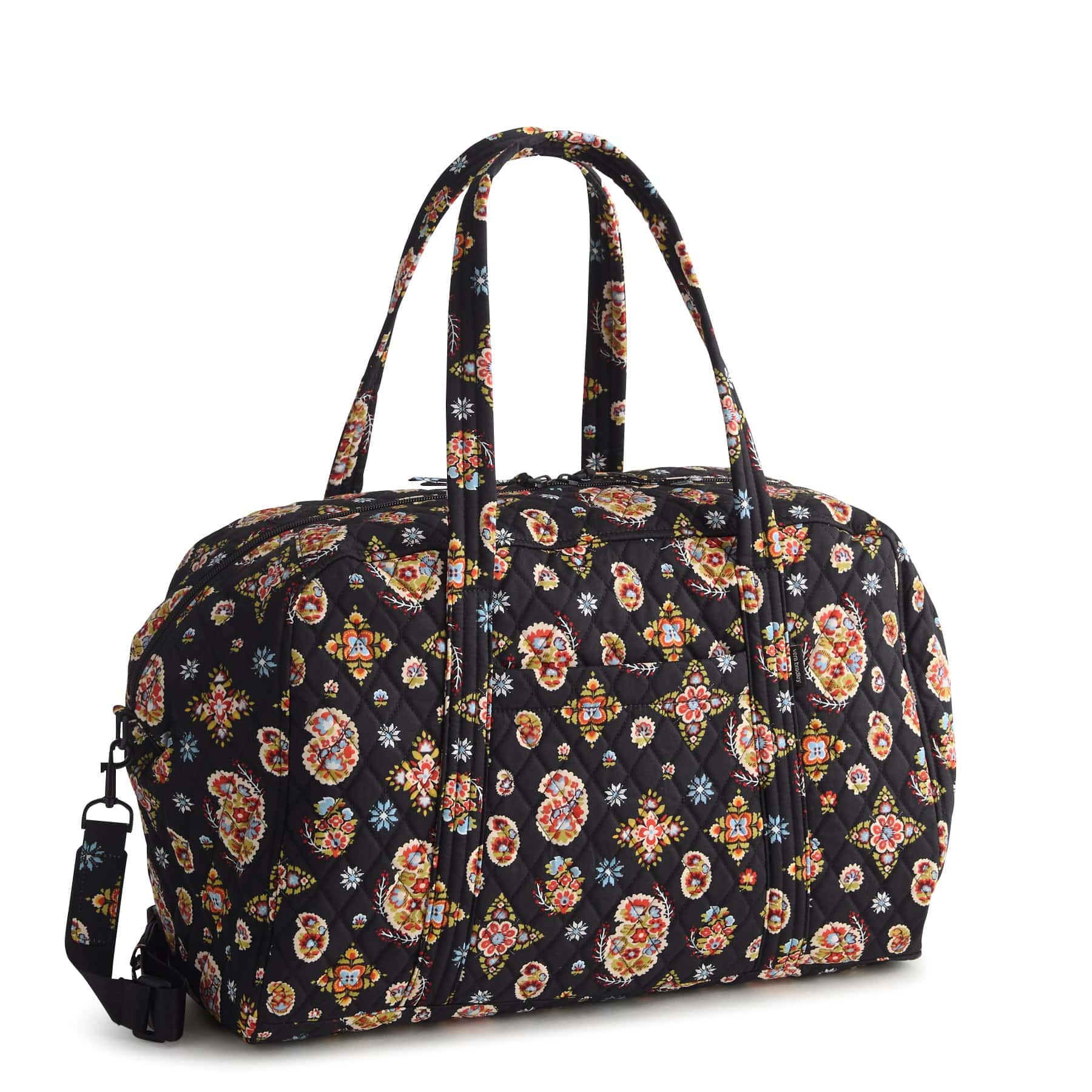 black quilted cotton weekender bag with brightly colored paisley pattern