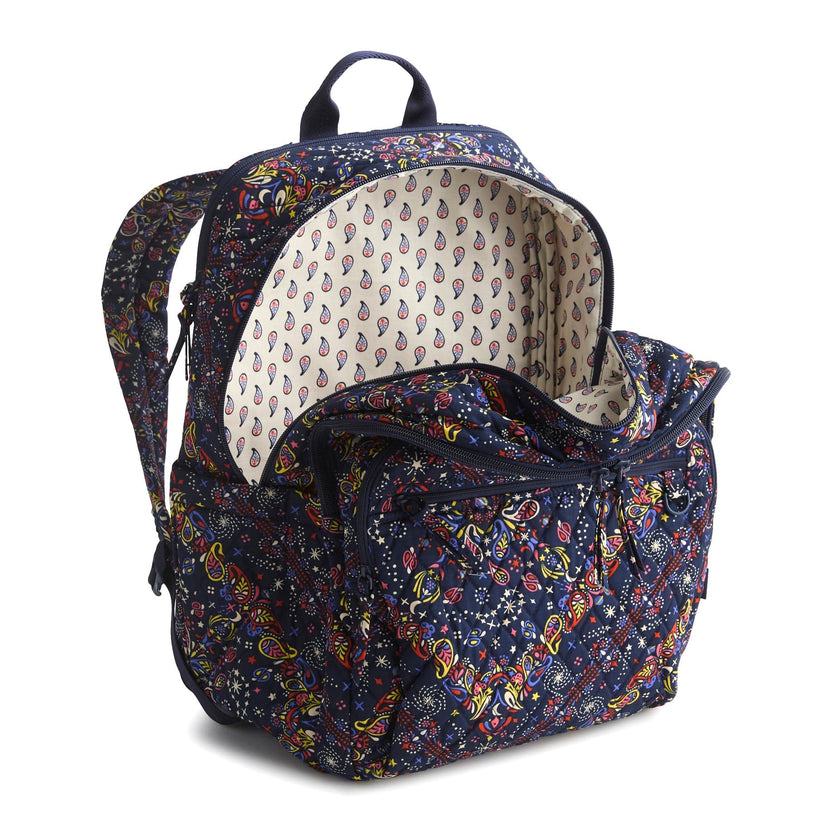 dark blue backpack with red and yellow paisley pattern shown open with cream and paisley interior